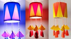 three different colored lamps hanging from the ceiling