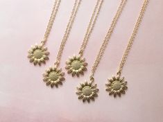 ITEM DETAILS This beautiful Gold Sunflower Necklace is the perfect accessory for floral lovers. The pendant is handmade with love, featuring a delicate sunflower design in a bright and shiny yellow gold finish. The dainty size makes it perfect for everyday wear, while the floral design adds a touch of elegance and charm to any outfit. It also makes a thoughtful and unique gift for any occasion! Pendants are available in 16", 18", and 20" 14K gold-plated chains. SHIPPING DETAILS - Processing time Summer Flower Pendant Necklace Gift, Summer Flower Charm Necklace As A Gift, Summer Flower Charm Necklace For Gift, Summer Gift Jewelry With Sunflower Design, Summer Flower Charm Necklace As Gift, Summer Gift Necklace With Flower Charm, Gold Flower Necklace For Summer Gifts, Summer Gold Jewelry With Sunflower Design, Gold Flower Necklace For Summer