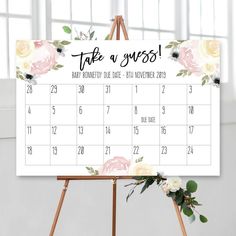 a calendar with flowers on it and the words take a guess written in black ink