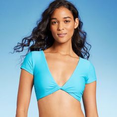 Bralette bikini top from Wild Fable™ in a solid hue with a plunging V-neckline and a twist-front accent. Designed in a crop top silhouette with short sleeves. Made of a soft, stretchy fabric with removable cups. Pullover style completes the look and allows for easy on and off. If you’re not satisfied with any Target Owned Brand item, return it within one year with a receipt for an exchange or a refund. Wild Fable™: A look for every story. Crop Top Bra, Cute Fit, Cute Bikinis, Short Sleeve Pullover, Cheeky Bikinis, Twist Front, Wild Fable, Swimwear Fashion, Swim Suit