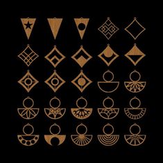 a collection of wooden earrings on a black background