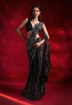 Embrace elegance with this black sari, showcasing large flower embroidery and intricate 3D flower work on the palla. The ensemble is completed with an embellished blouse, offering a perfect blend of dramatic floral details and luxurious craftsmanship for a stunning and sophisticated look. Large Flower Embroidery, Organza Sari, Black Sari, Gala Looks, Ethnic Wears, Drape Sarees, Reception Saree, Pakistani Women Dresses, Sari Design