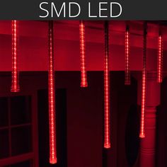 some red lights hanging from the ceiling in a dark room with text overlay that reads, smd led