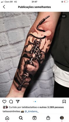 a man with a tattoo on his arm holding a fishing hook and some fish hooks