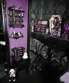 a purple and black room with lots of decorations on the wall, including an ornate mirror