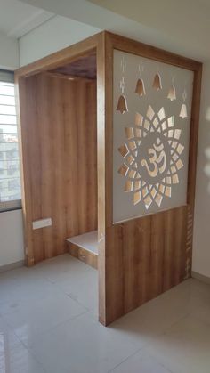 a room with wooden walls and white tile flooring that has an intricate design on the wall