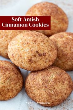 some cinnamon cookies are stacked on top of each other with the words soft amish cinnamon cookies above them