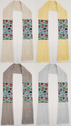 four scarfs with different designs on them, one is yellow and the other two are gray