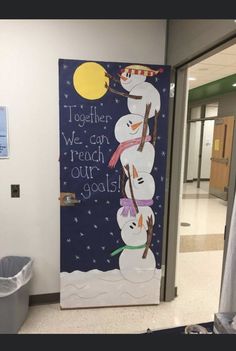 a door decorated with snowmen and the words together we can reach our goals on it