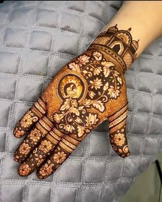 a woman's hand with hennap on it, showing the intricate design