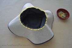 a sewing project that is being made with felt and fabric, including a pot holder