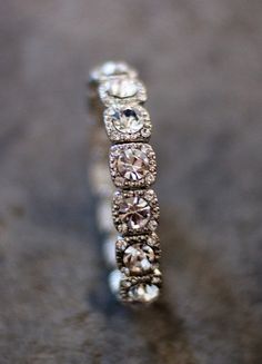 a diamond ring is sitting on the ground