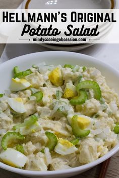 a white bowl filled with potato salad next to a plate full of rice and vegetables