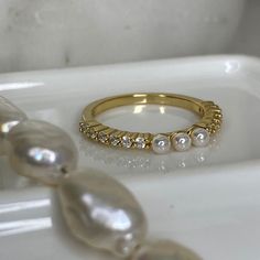 "Beautiful, 14k gold plated, dainty pearl purity ring.  \"Blessed are the pure in heart, for they shall see God.\" Matthew 5:8 <3 * Made of 925 Sterling Silver * THICK plating of 14k Gold All sales are Final Sale on all Purity Rings, so make sure you know your correct measurements + ring size! :)" Everyday Gold Ring With Pearl Charm, Classic Gold Stackable Pearl Rings, Classic Gold Pearl Ring With Halo, Stackable Pearl Ring For Anniversary, Fine Jewelry Stackable Pearl Ring For Anniversary, Pearl Stackable Rings For Anniversary, Gold Classic Pearl Ring For Promise, Gold Pearl Ring With Halo, Gold Pearl Promise Ring In Classic Style