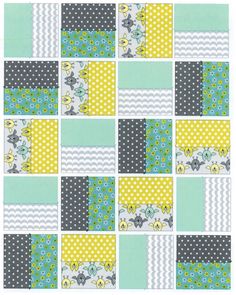 a patchwork quilt with yellow, blue and grey squares on it's sides