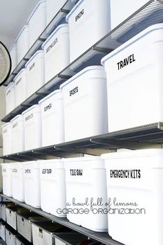 several white storage containers are on the shelves