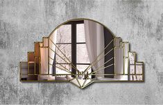 an art deco style mirror on the wall