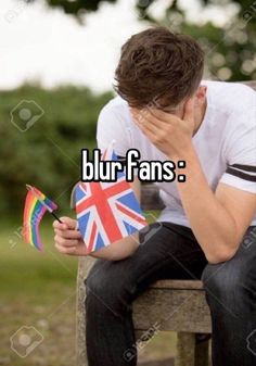 a man is sitting on a bench with his head in his hands and the words blur fans