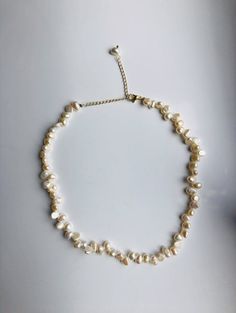 A stunning piece of Baroque style real pearl necklace. The freshwater pearls are completely natural and hand-made with 14k gold-filled chains. The chains are adjustable and fit most necks. No matter it's an elegant wedding or fancy Friday evening, it will definitely make you shine out of the crowds. Perfect for brides or your loved friends. Some highlights of this beautiful irregular shaped pearl beaded necklace are : *High quality guaranteed. Real natural pearls, handmade with 14k gold-filled c Delicate Pearl Necklace For Jewelry Making, Delicate Single Strand Baroque Pearl Necklace, Wedding Beaded Necklaces With Baroque Pearl Drop, Wedding Baroque Pearl Beaded Necklaces With Pearl Drop, Wedding Baroque Pearl Beaded Necklace With Pearl Drop, Handmade Dainty Baroque Pearl Necklace, Adjustable Delicate Baroque Pearl Necklace, Adjustable Pearl Necklace With Pearl Drop, Adjustable Baroque Pearl Necklace