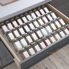 an open drawer filled with lots of spices