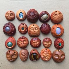 a group of wooden buttons with faces on them