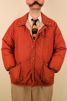 "Item Description: 1970's Burnt Orange Down Puffy Jacket Hunter Lumberjack Outdoorsman Vintage Mens Men's Menswear Big and Tall 48R Brand: Origin: Era: 1970's Condition: Normal Vintage Wear. two light stains about the size of a dime on the back left sleeve Listed Size: 48R Measurement (Laid Flat) Size:48R Shoulders: \" Bust:25\" Waist:25\" Hips:25\" Length:32\"" Brown Long Sleeve Sport Coat With Padded Collar, Retro Single-breasted Winter Outerwear, Winter Brown Sport Coat With Padded Collar, Vintage Sport Coat With Button Closure For Outdoor, Vintage Sport Coat With Pockets For Cold Weather, Retro Winter Outerwear With Button Closure, Retro Winter Outerwear With Padded Collar, Retro Brown Outerwear For Cold Weather, Vintage Long Sleeve Outerwear For Cold Weather