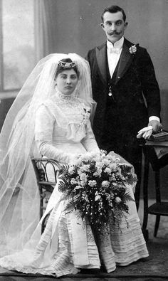 an old black and white photo of a bride and groom