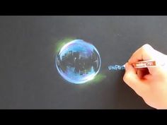 a person is drawing an image on a piece of paper