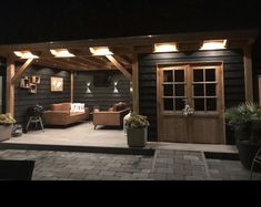 an outdoor living area lit up at night