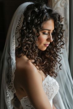 a woman wearing a wedding dress and veil