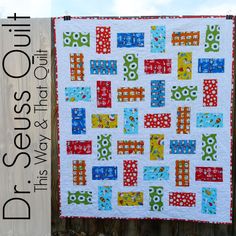 a quilt hanging on a wooden fence with the words diy sew and quilt