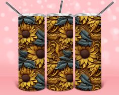 two yellow sunflowers with blue leaves and green leaves are on the side of this can cooler