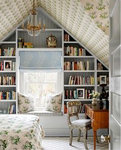 an instagram photo of a bedroom with built in bookshelves and window seat