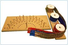 an assortment of wooden pegs and thread spools