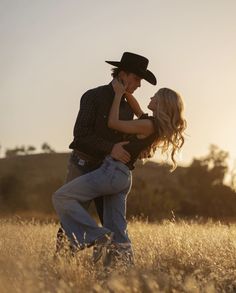 a man and woman are dancing in a field