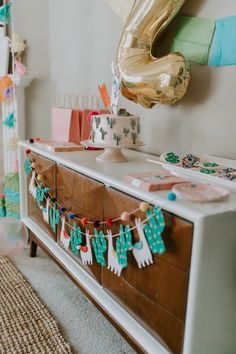 a dresser with some decorations on it