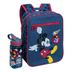 Add a skip to their step with this junior backpack featuring an exuberant Mickey jumping for joy. The denim design includes an exterior zip pocket, appliqué patches, and a Mickey silhouette print that will shadow them wherever they go. Safety WARNING: CHOKING HAZARD - Small Parts. Not for children under 3 years. CAUTION: Entanglement hazard. Keep away from very young children. Do not place around neck. Magic in the details Small backpack Mickey screen art ''The Mouse'' and ''28'' applique patche Casual Mickey Mouse Backpack For Back To School, Casual Mickey Mouse School Backpack, Casual Mickey Mouse Backpack, Cute Backpacks For School, Sustainable Backpack, Mickey Silhouette, Denim Backpack, Jumping For Joy, Cute Backpacks