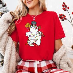 Snowman Xmas Lights Shirt, Funny Snowman Winter Shirt, Frosty Christmas Shirt, Snowman Holiday Shirt, Frosty And Friends Shirt, Xmas Movies, 🌟 Welcome to our comfortable t-shirts and fashion aficionados alike!  PRODUCT DETAILS: We're proud to use premium shirts from Bella Canvas and Gildan Soft Style for our prints. Bella Canvas: Unisex sizing Lightweight at 4.2 oz. Available in various compositions including 100% Combed Cotton, Ring-Spun Cotton, and Polyester blends. Gildan Soft Style: Unisex Xmas Movies, Funny Snowman, Xmas Lights, Winter Shirts, Holiday Shirt, Friends Shirt, Holiday Shirts, Christmas Shirt, Soft Style