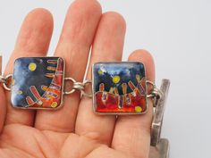 "Listing is for a Unique Art Studio abstract Avant-Garde cloisonné enamel / glass mosaic sterling silver toggle bracelet. Designer signed bracelet with unique microcellular abstract design with 4 sterling silver panels. Bracelet measures 8\" end to end, square panels measure 1\" x 1\", rectangular is 1.3\" x 0.7\". Bracelet is tested positive for silver by acid & magnet testing. Bracelet is engraved on the back. Weight is 82.6 grams. No surface scratches on the glass. Unique one of a kind ha Modernist Multicolor Jewelry For Gifts, Modernist Multicolor Jewelry As A Gift, Multicolor Modernist Jewelry For Gifts, Multicolor Modernist Jewelry As A Gift, Enamel Bracelet Jewelry With Lobster Clasp, Enamel Bracelet With Lobster Clasp, Multicolor Hand Painted Metal Jewelry, Hand Painted Multicolor Metal Jewelry, Multicolor Enamel Jewelry With Lobster Clasp