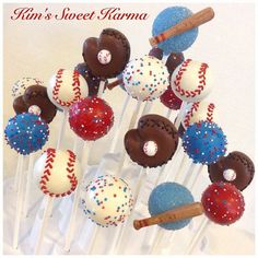 cake pops decorated with baseballs and stars are on a white tablecloth that says kin's sweet karma