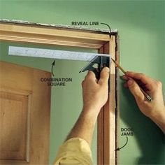 a person is working on the door frame