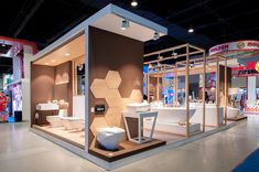 an exhibit room with several different types of toilets and sinks on display in the center