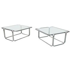 pair of chrome and glass coffee tables