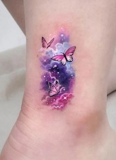 two butterflies flying in the sky with clouds and stars on their ankle tattoo designs for women