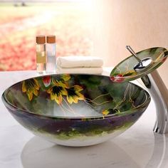 a bowl shaped sink sitting on top of a counter