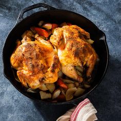 chicken and vegetables in a cast iron skillet