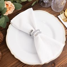 a white plate topped with two napkin rings