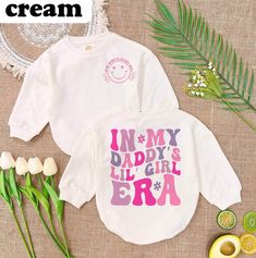 In My Daddy's Lil Girl Era Romper, Daddy & Me Bodysuit Shirt,Romper Sweatshirt for Baby Girl ,Baby Outfit,Daddy's Girl Tee, Fathers Day Gift - Handmade  - Ships from USA  - Materials: 100% CPSIA Compliant and Ethically Made material Light fabric (5.0 oz/yd² (170 g/m  Crafted with soft, breathable fabric, this romper ensures your baby stays comfortable through playtimes and nap times alike. Featuring charming designs suitable for all babies, our romper is as adorable as it is practical.  Quick Si Cute Cartoon Print Top For First Birthday, Cute Cartoon Print Tops For First Birthday, Graphic Print Long Sleeve Top For First Birthday, Cute Cartoon Print Tops For Mother's Day, Cute Letter Print Top For First Birthday, Spring First Birthday Tops With Letter Print, Cute Long Sleeve Tops For Mother's Day, White Long Sleeve Tops For First Birthday, Cute Long Sleeve Tops