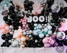 a bunch of balloons that are in the shape of boos and skulls on a table