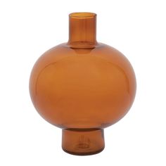 an orange glass vase sitting on top of a table